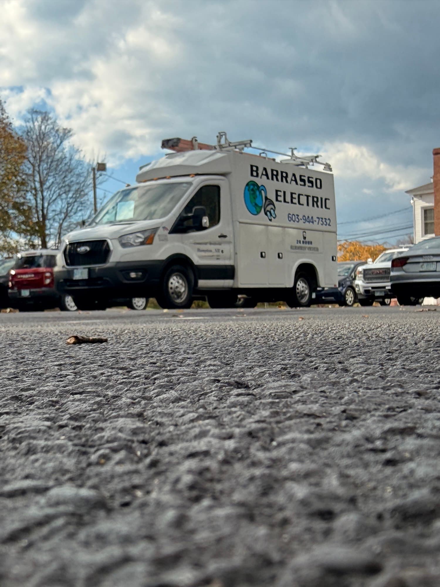 The Barrasso Electric van seen low from across a parking lot in Hampton